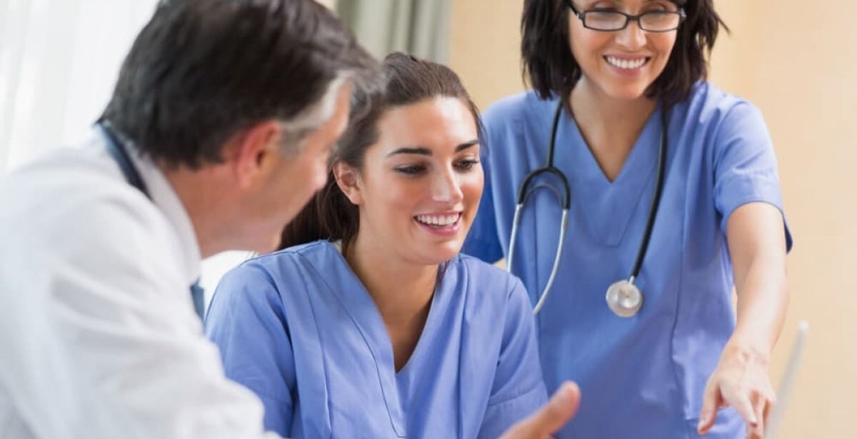 Nurses and a doctor working together.