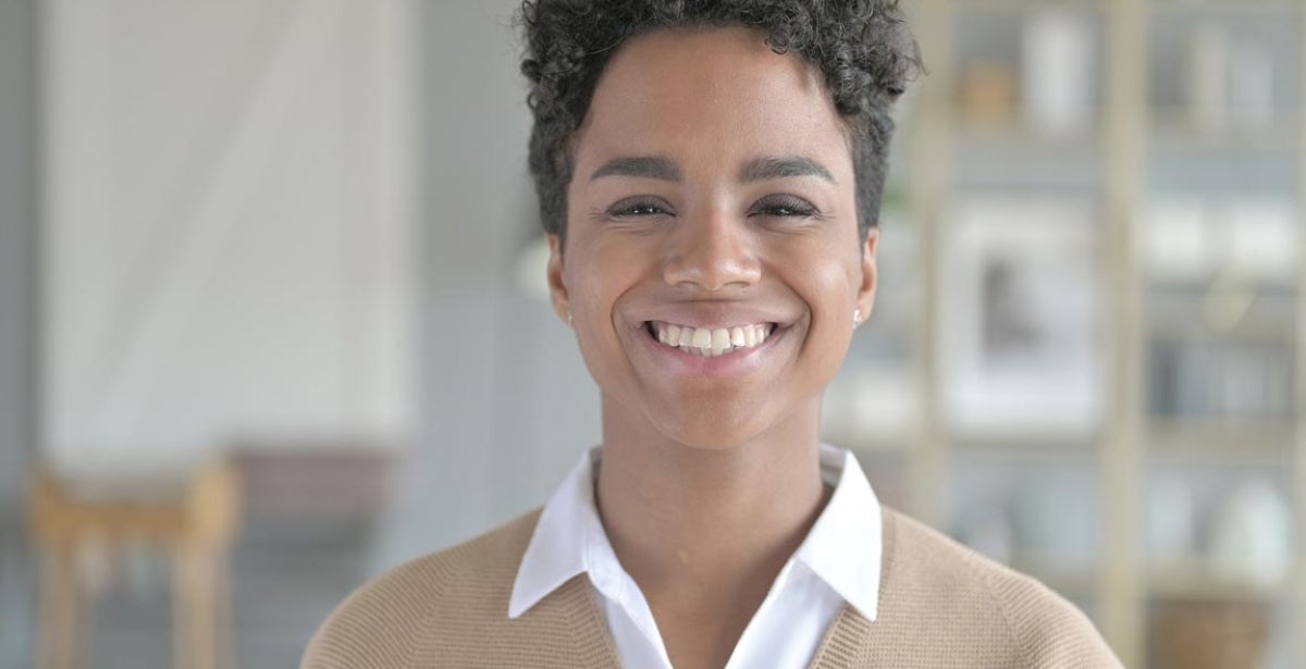 A smiling postgraduate student.