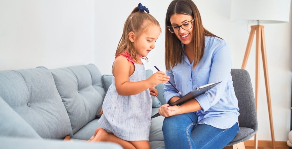 A child and adolescent mental health specialist working with a patient.