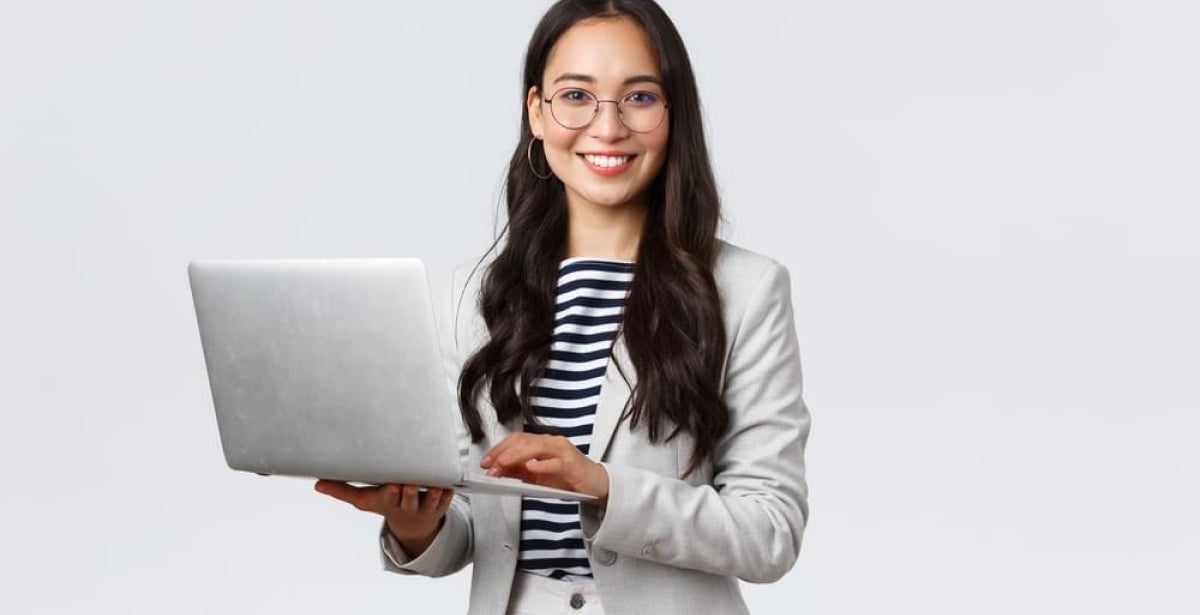 Financial planner holding a laptop.