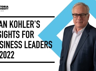 Financial journalist Alan Kohler, wearing a suit and smiling.
